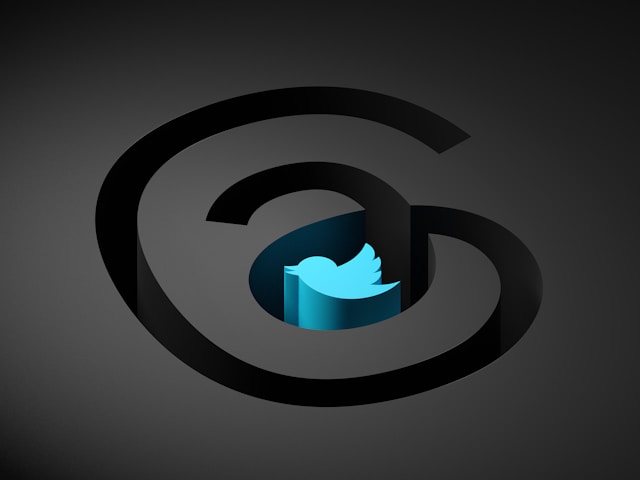 The Threads logo surrounding the Twitter bird logo, symbolizing a connection between the two social media platforms.
