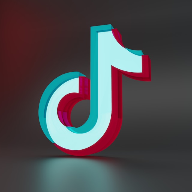 A close-up of the TikTok logo, displayed in vibrant 3D with a cyan, red, and white color scheme.