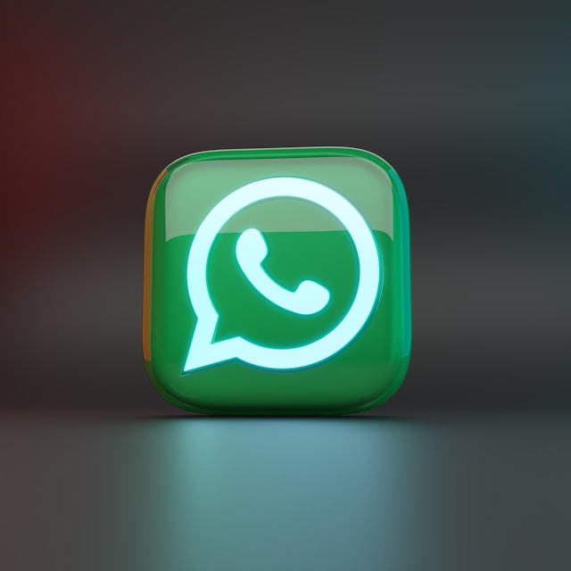 3D WhatsApp logo in green with a glowing phone icon in the center, displayed on a glossy rounded square against a dark gradient background.