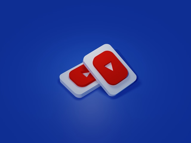 Two overlapping YouTube play icons on a solid blue background.