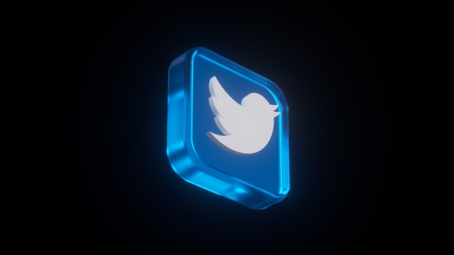 A 3D illuminated Twitter icon against a dark background, highlighting the platform's modern and dynamic presence.