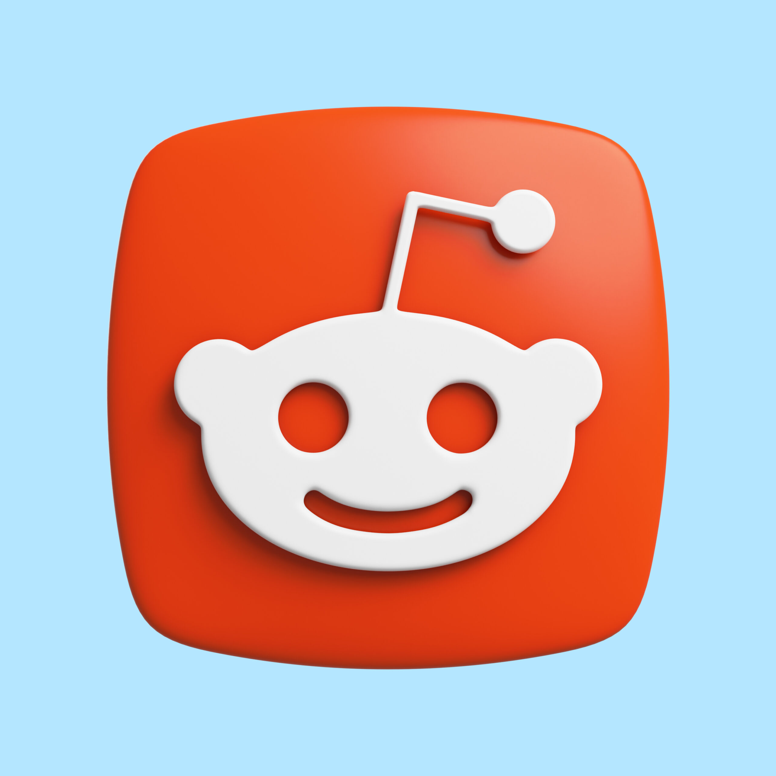 A bright red Reddit icon on a light blue background.
